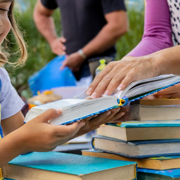 Woman and young girl reading together, symbolizing Tucson literacy empowerment.